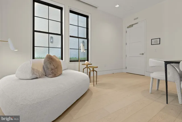 a bedroom with a bed and a chair