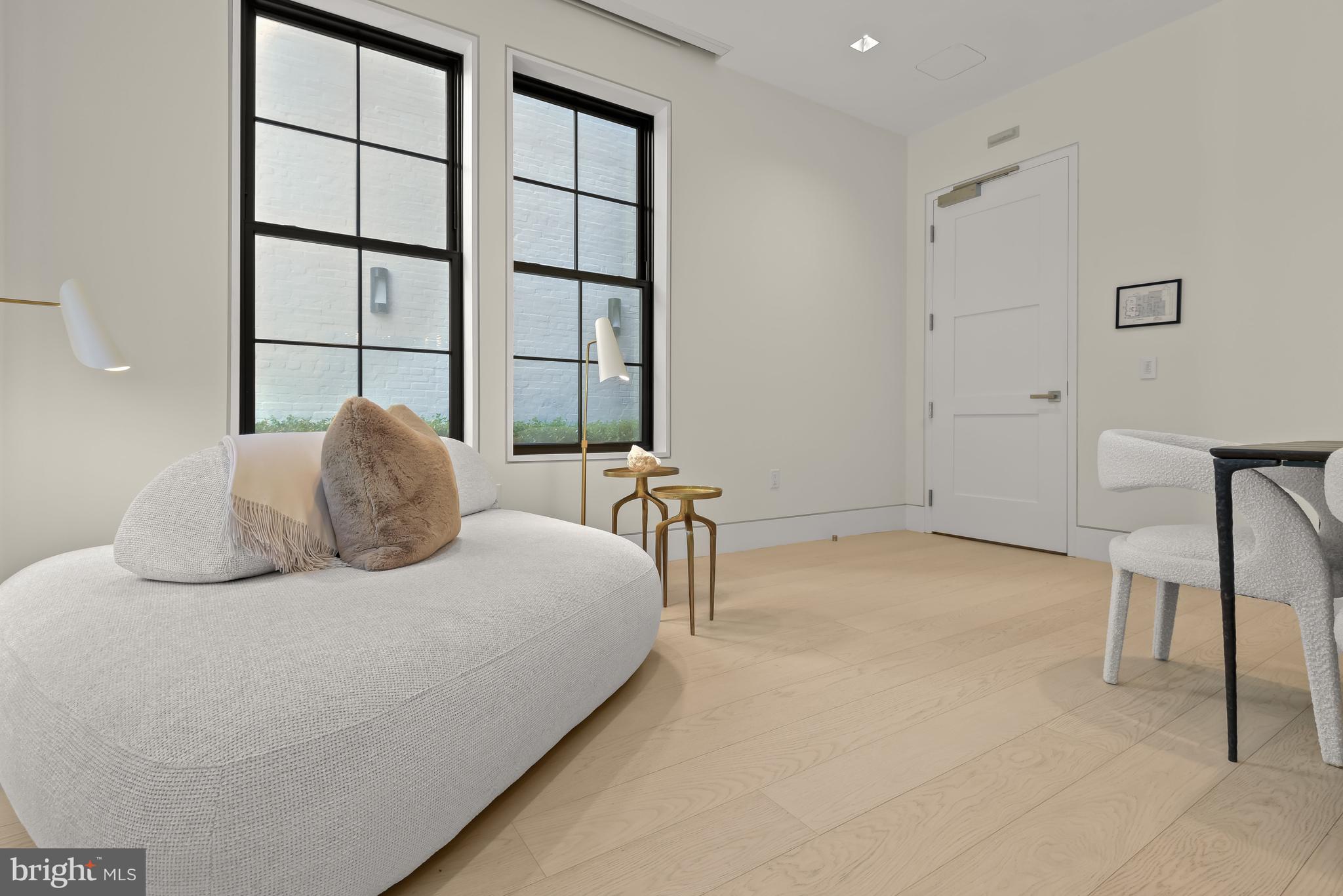 3255 Prospect Street Northwest, Unit ONE Washington, DC 20007 - Photo 3 of 18 a bedroom with a bed and a chair