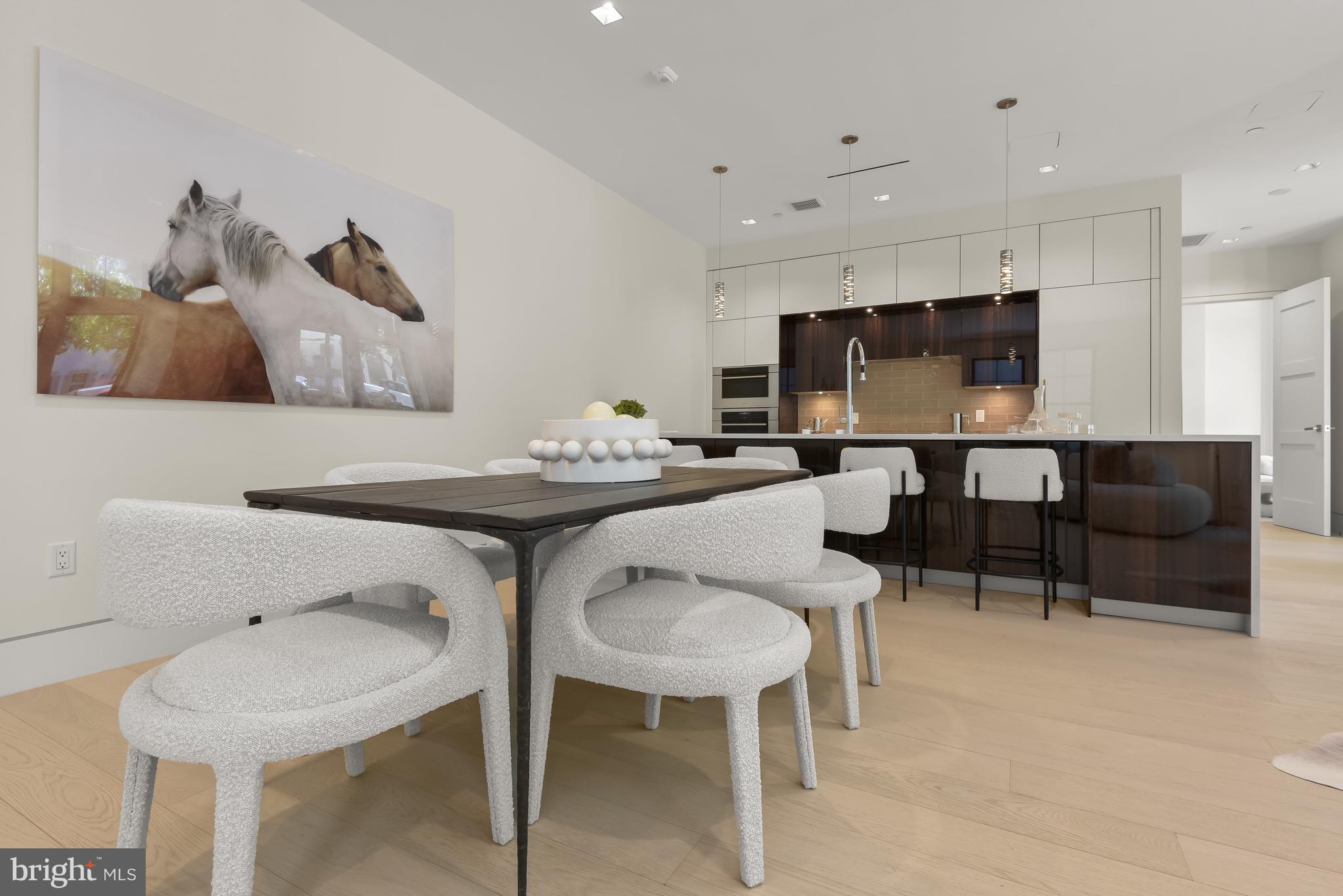 3255 Prospect Street Northwest, Unit ONE Washington, DC 20007 - Photo 6 of 18 a living room with furniture and a flat screen tv
