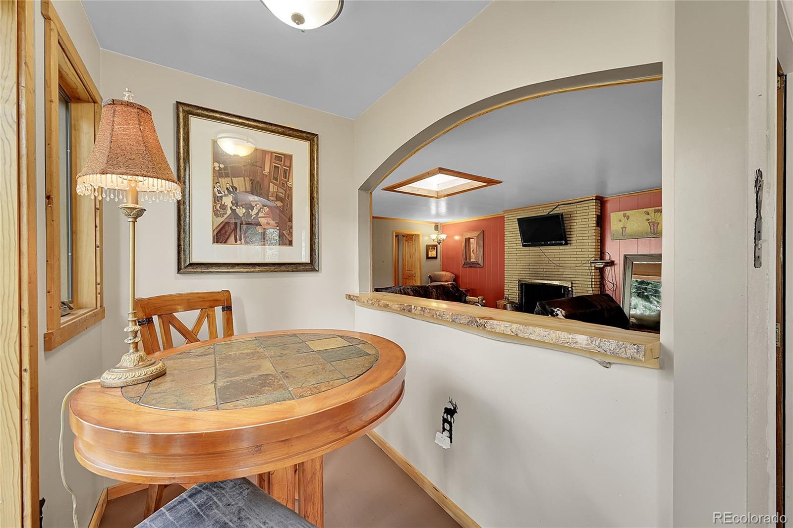14432 South Elk Creek Road Pine, CO 80470 - Photo 34 of 50 a living room with furniture and a flat screen tv