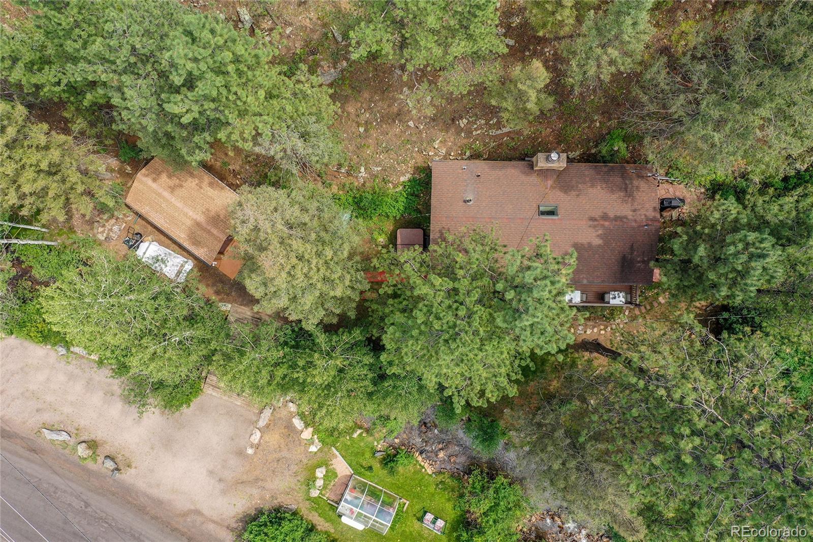14432 South Elk Creek Road Pine, CO 80470 - Photo 44 of 50 an aerial view of a house with yard and outdoor seating
