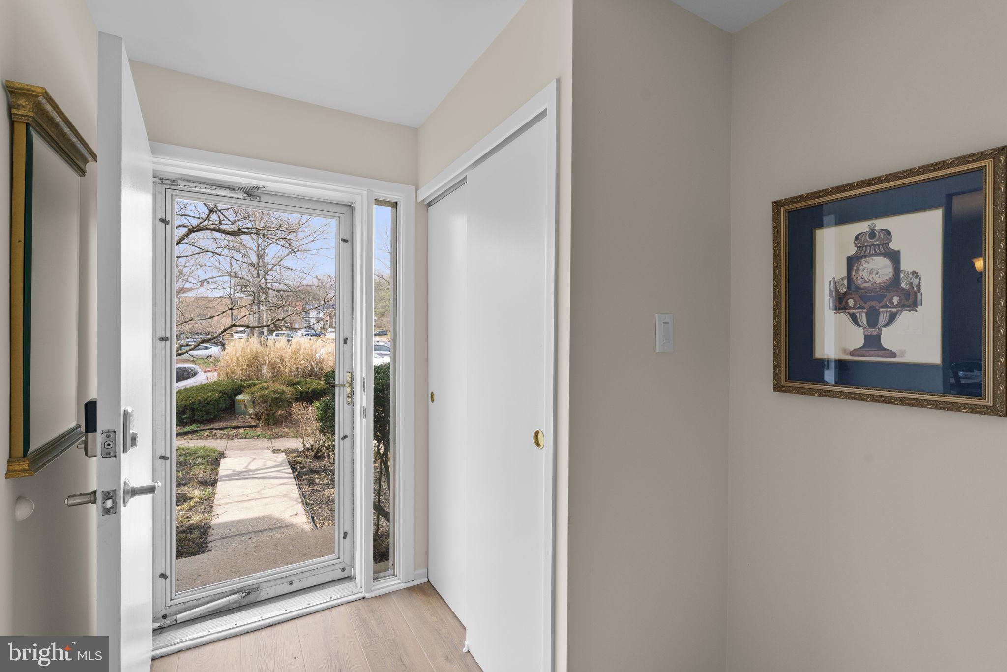 7263 Dockside Lane Columbia, MD 21045 - Photo 5 of 56 Storm door & coat closet in the entryway