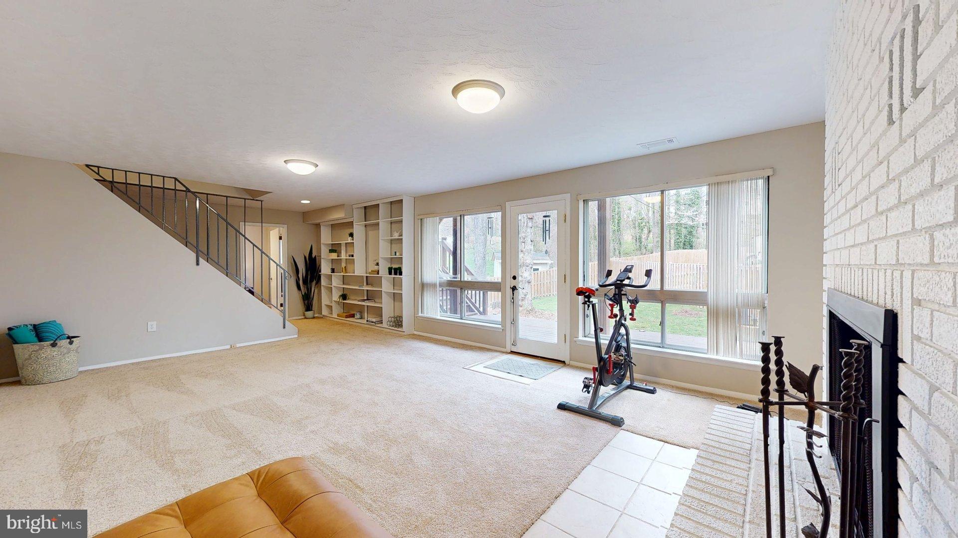 6334 Alberta Street Springfield, VA 22152 - Photo 16 of 28 a view of a livingroom with furniture and a fireplace