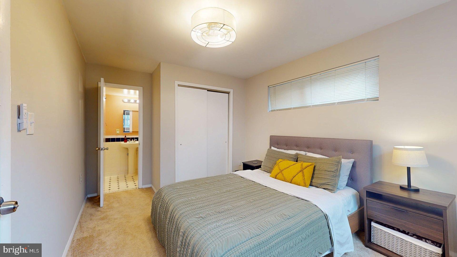 6334 Alberta Street Springfield, VA 22152 - Photo 19 of 28 a bedroom with a bed and a dresser