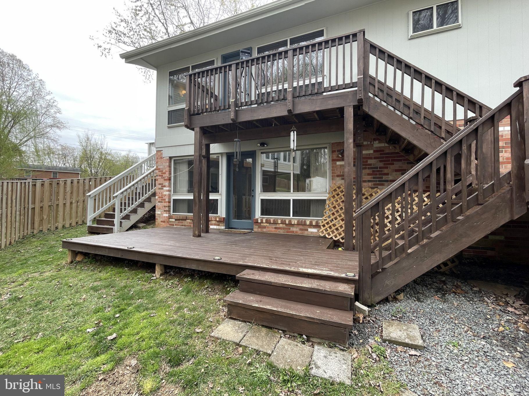 6334 Alberta Street Springfield, VA 22152 - Photo 26 of 28 a view of a house with wooden deck front of house