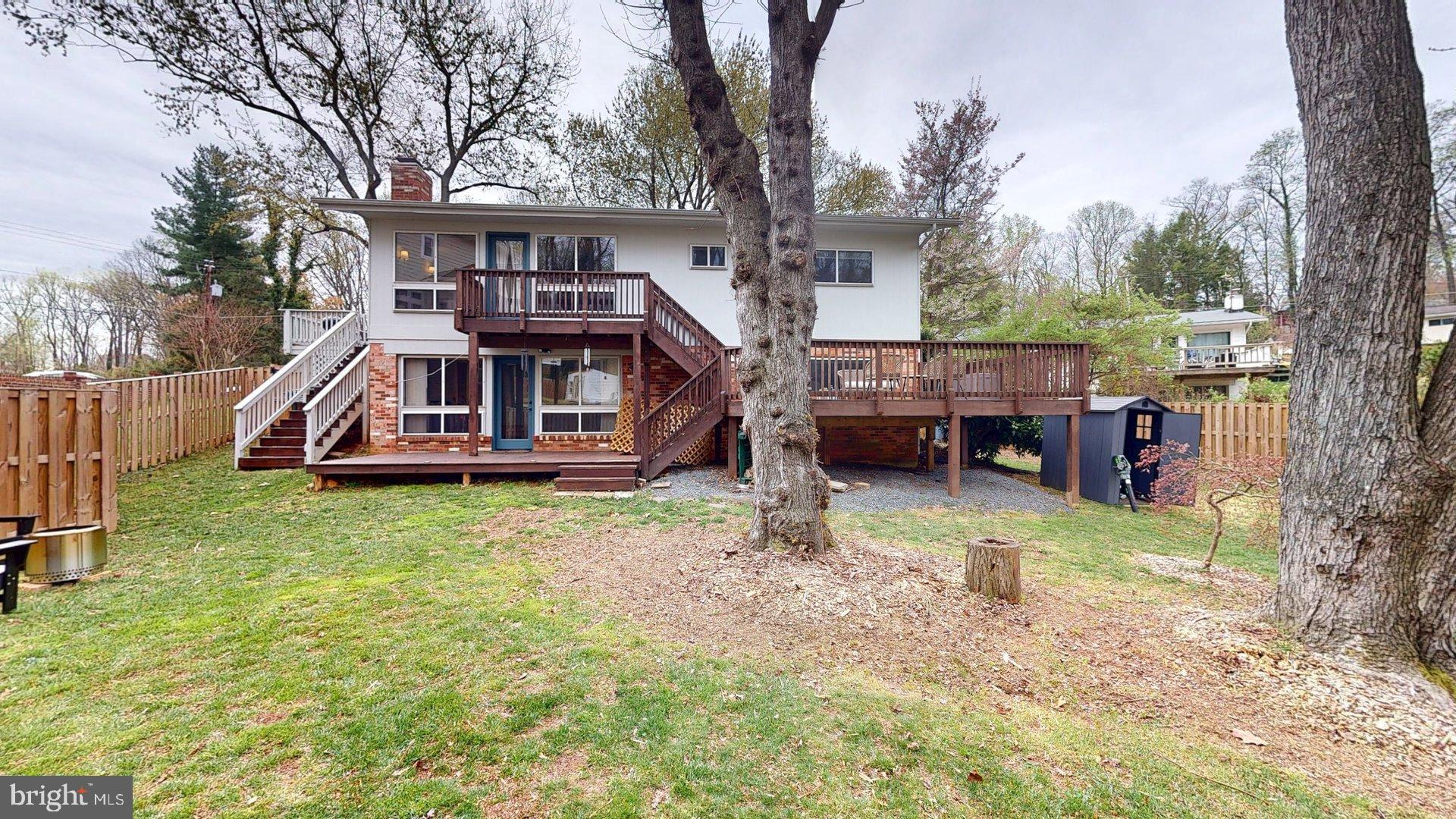 6334 Alberta Street Springfield, VA 22152 - Photo 28 of 28 a view of a house with a backyard and a patio
