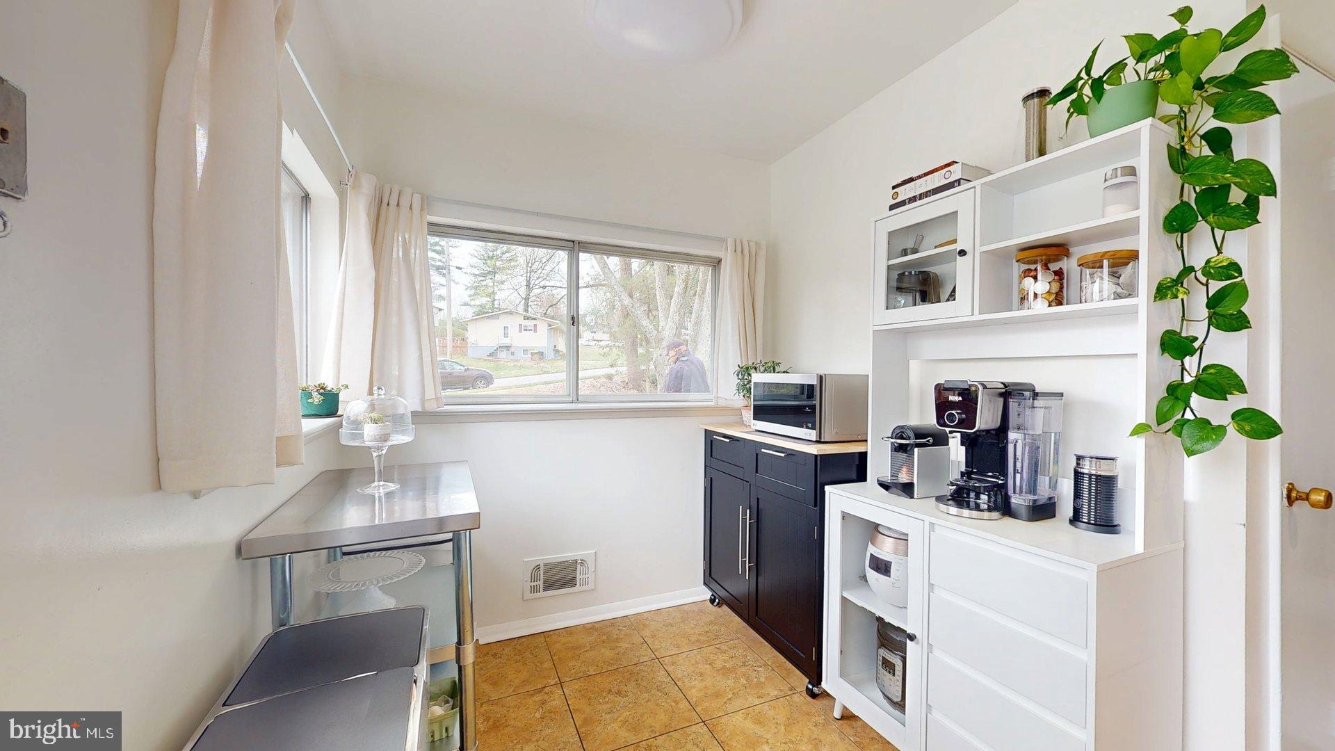 6334 Alberta Street Springfield, VA 22152 - Photo 8 of 28 a kitchen with a refrigerator and window