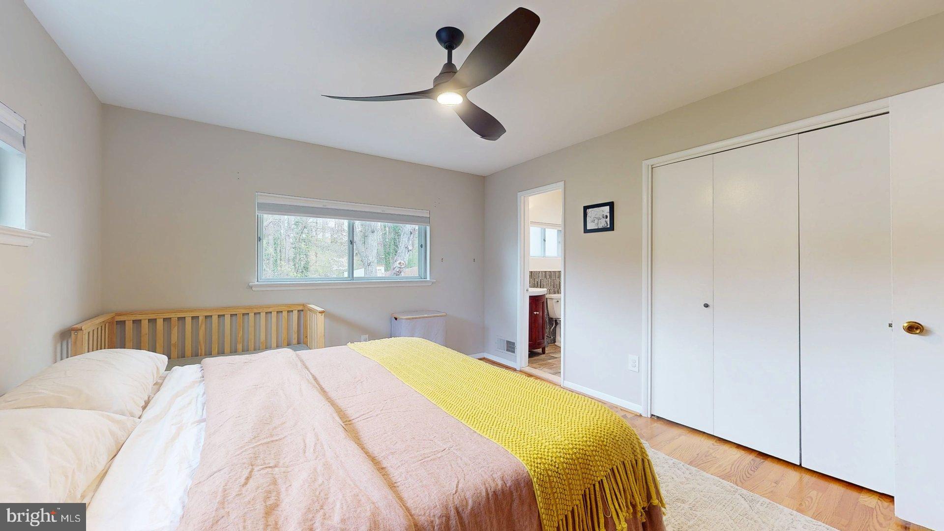 6334 Alberta Street Springfield, VA 22152 - Photo 10 of 28 a bed room with a bed and a chandelier