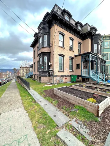 a front view of a house with swimming pool