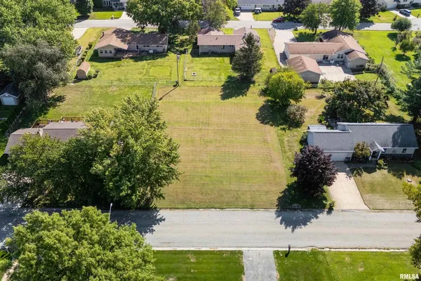 an aerial view of residential house with swimming pool