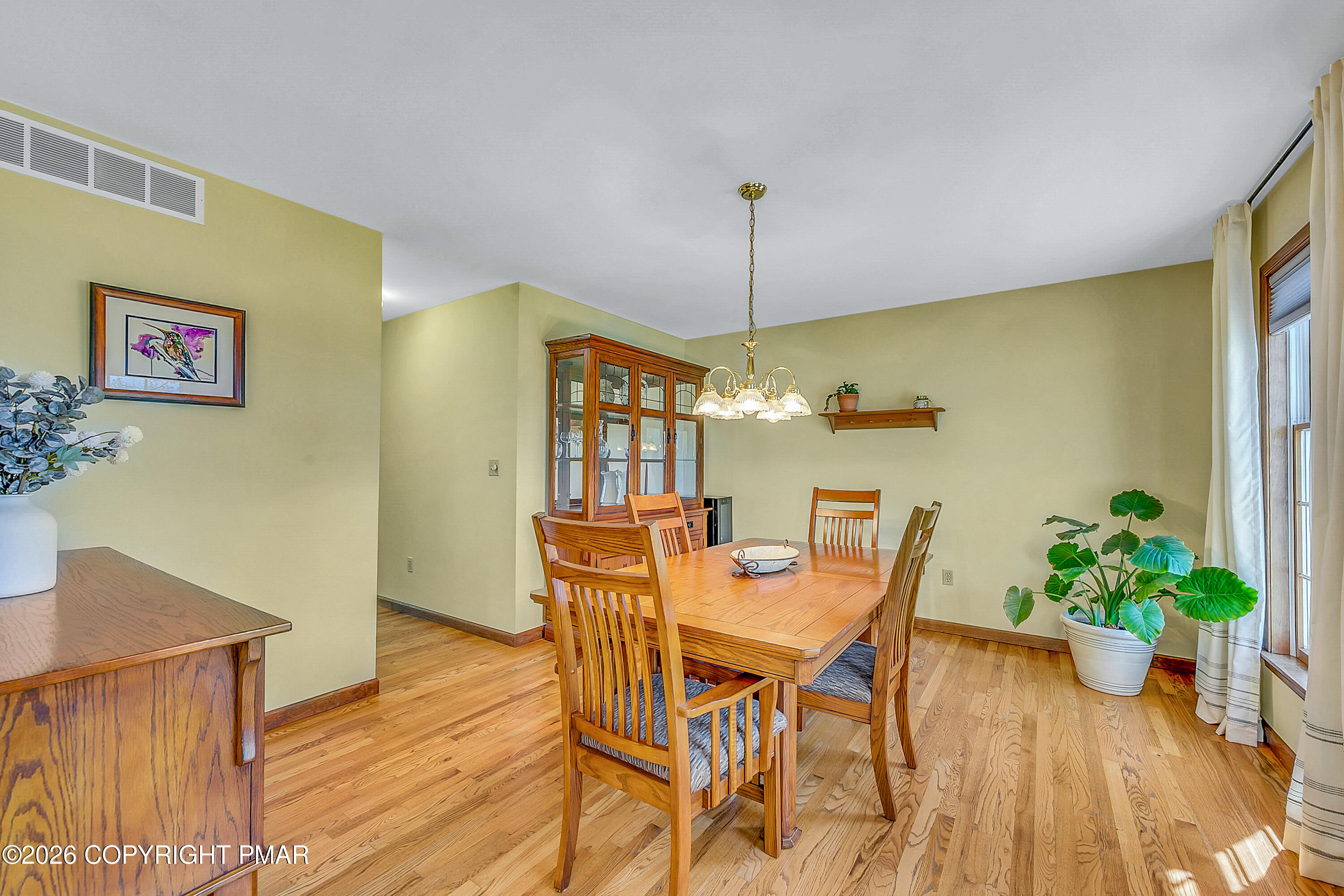 207 Smiley Lane Stroudsburg, PA 18360 - Photo 16 of 85 a view of a dining room with furniture and wooden floor