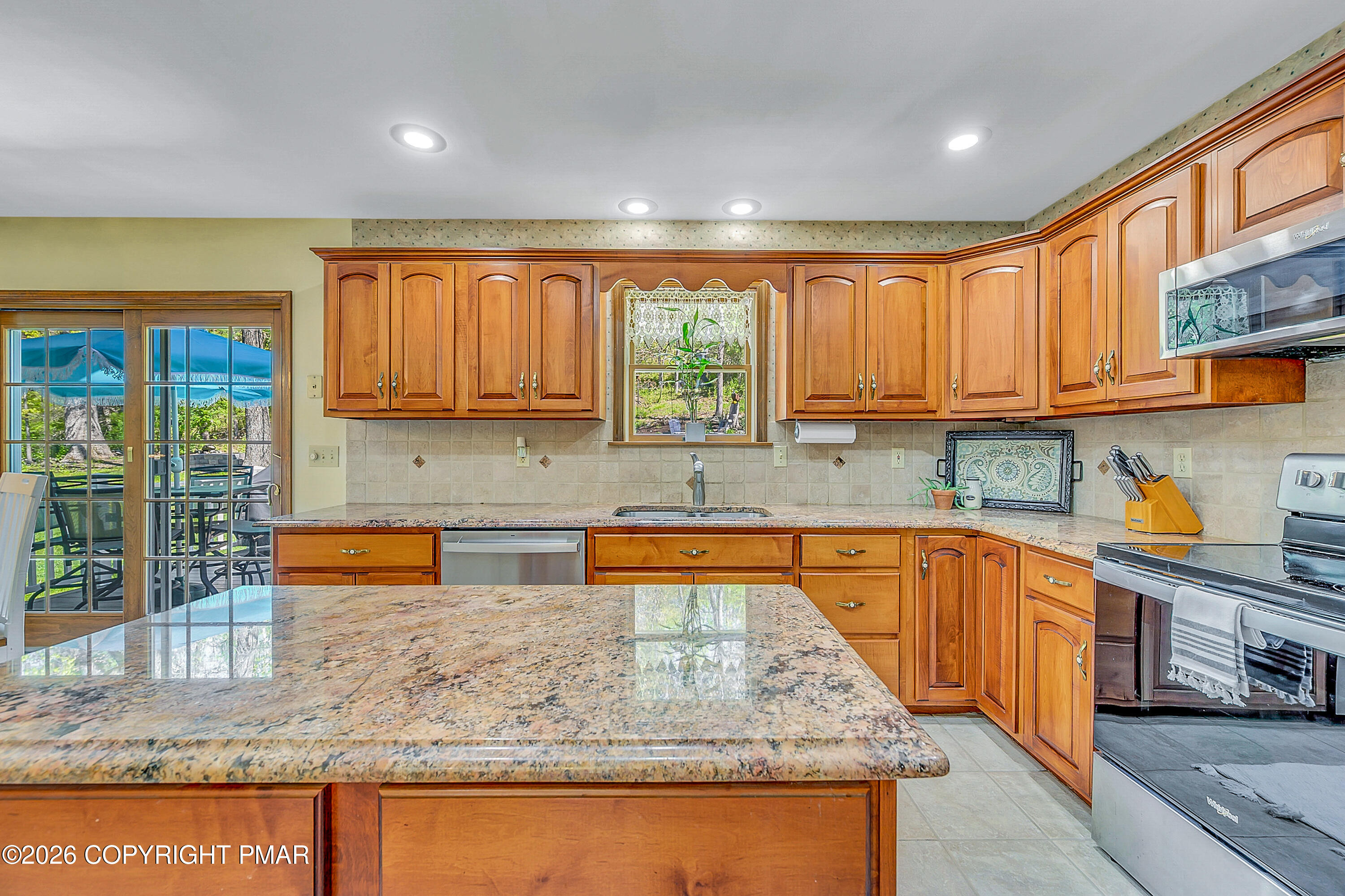 207 Smiley Lane Stroudsburg, PA 18360 - Photo 19 of 85 a kitchen with large windows and cabinets