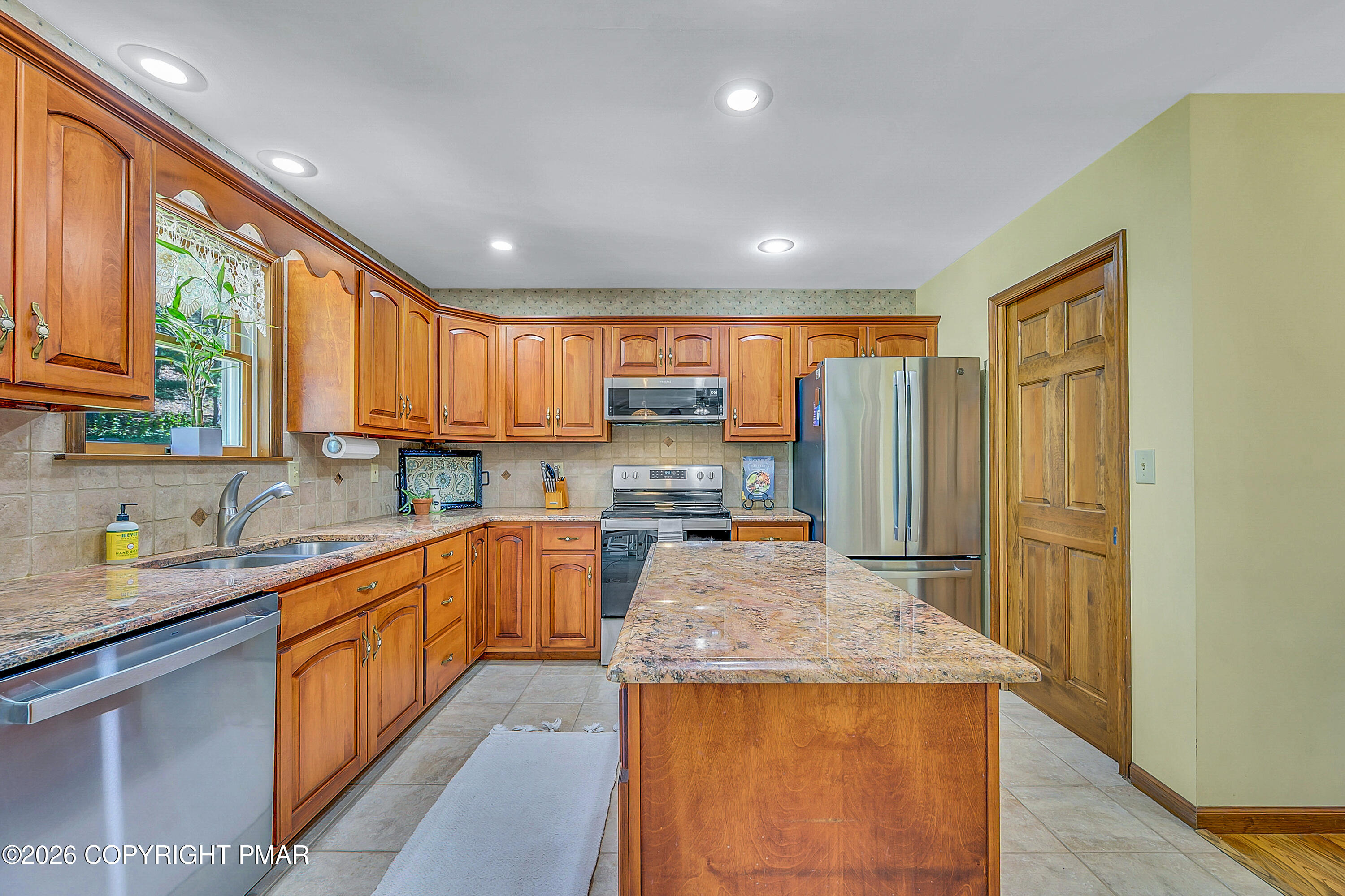 207 Smiley Lane Stroudsburg, PA 18360 - Photo 21 of 85 a kitchen with stainless steel appliances granite countertop sink stove and refrigerator