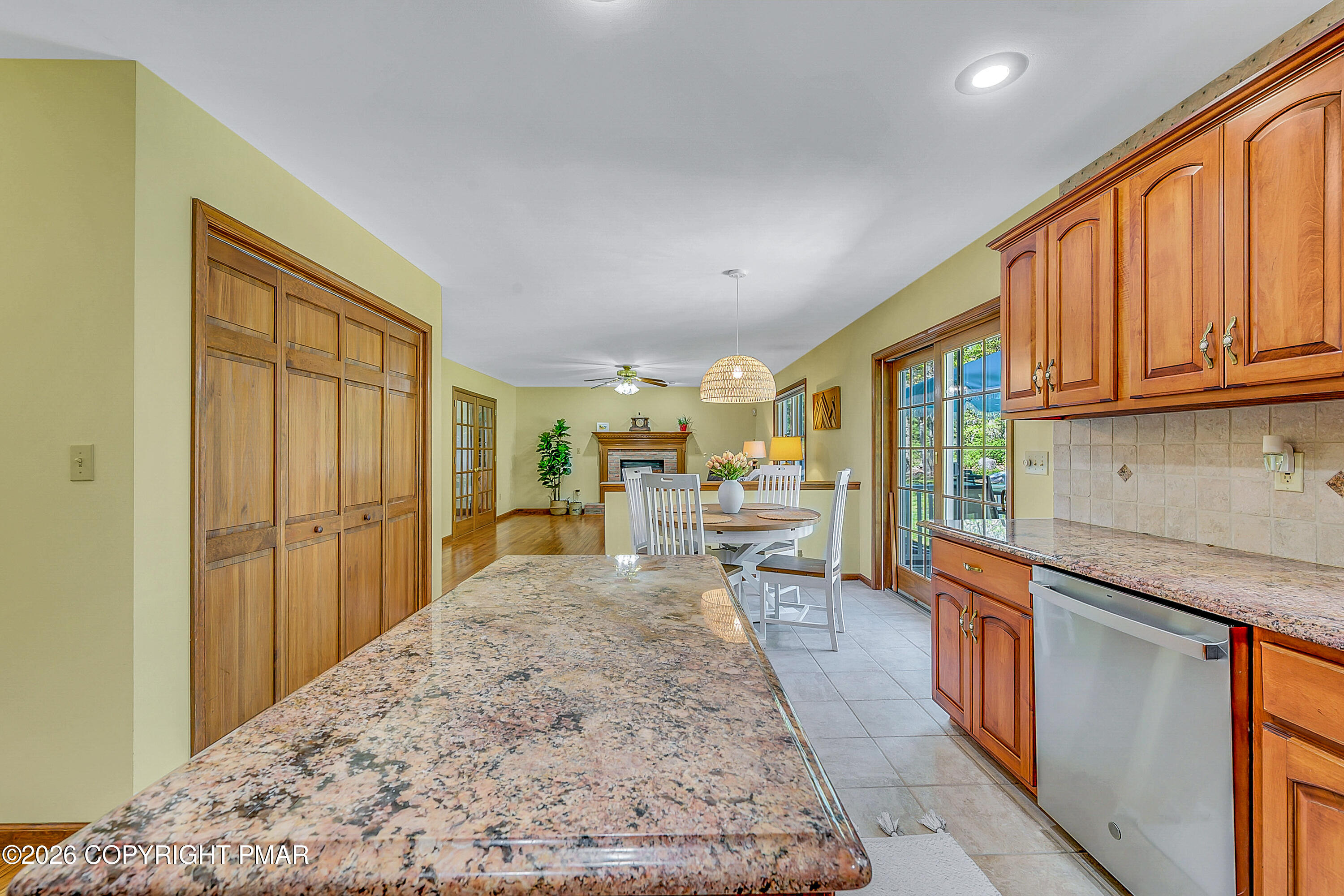 207 Smiley Lane Stroudsburg, PA 18360 - Photo 23 of 85 a large kitchen with kitchen island granite countertop wooden cabinets a granite counter tops and a view of living room