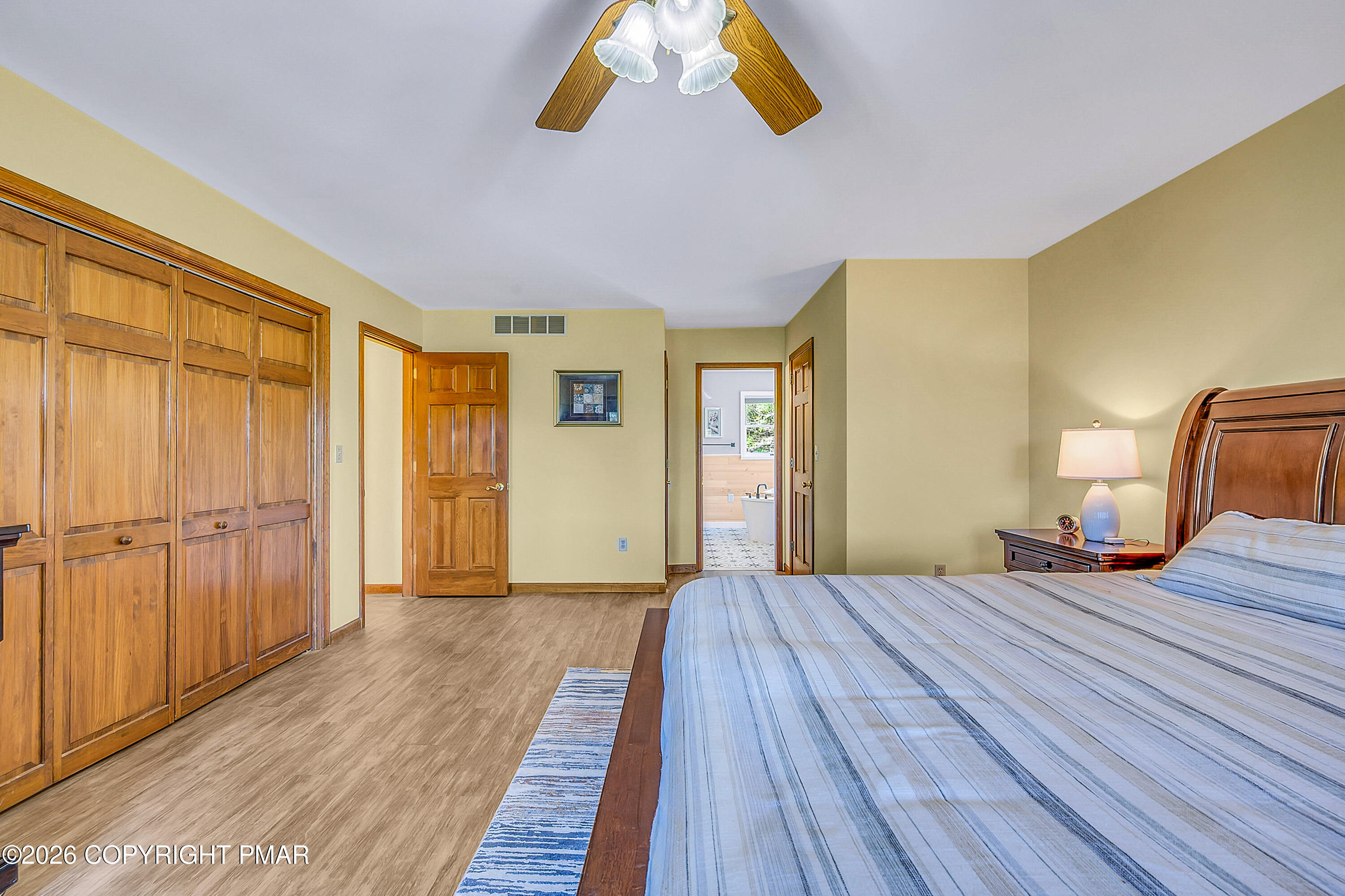 207 Smiley Lane Stroudsburg, PA 18360 - Photo 32 of 85 a bedroom with a bed and wooden floor