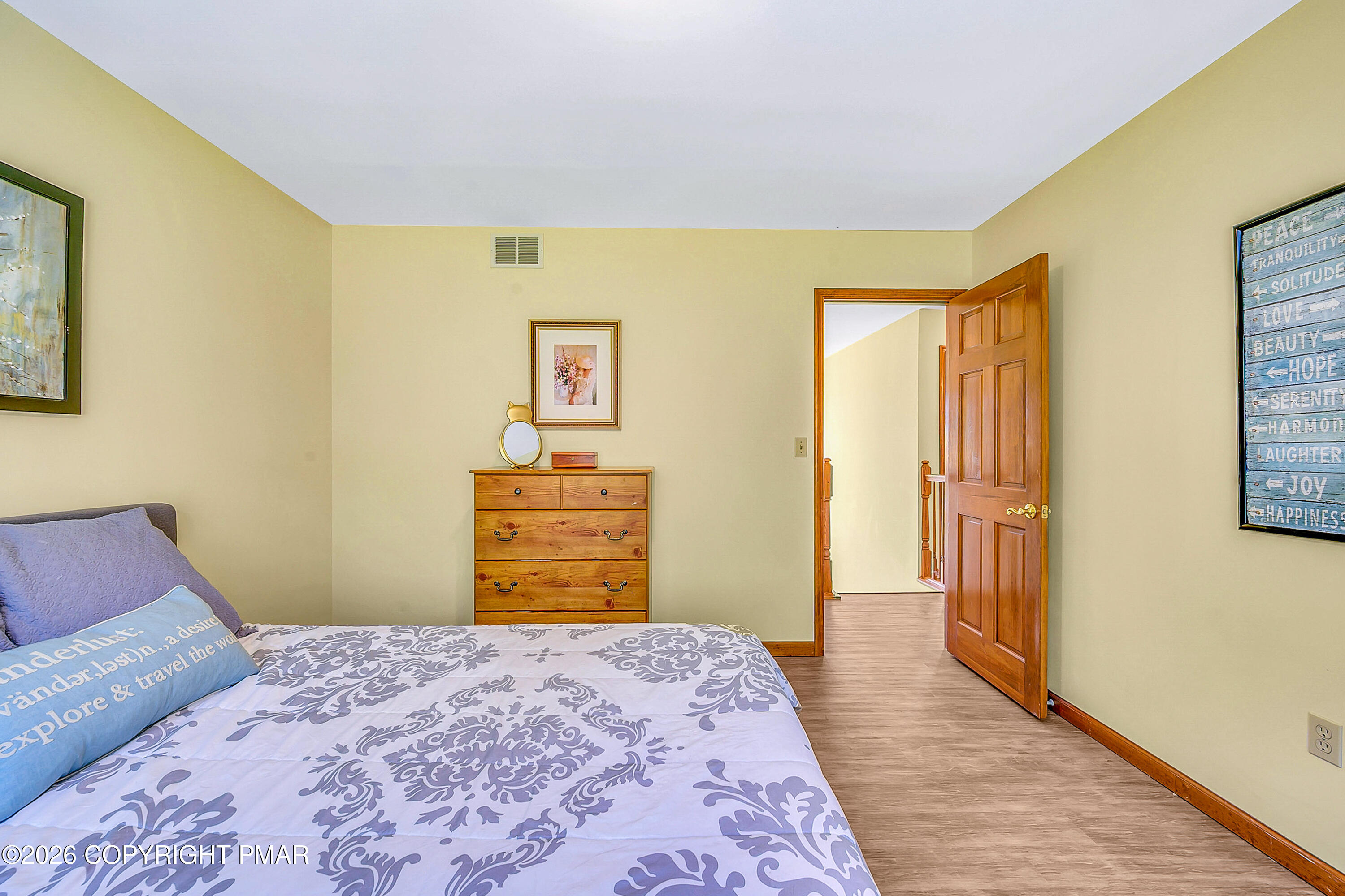 207 Smiley Lane Stroudsburg, PA 18360 - Photo 40 of 85 a bedroom with a bed and wooden floor