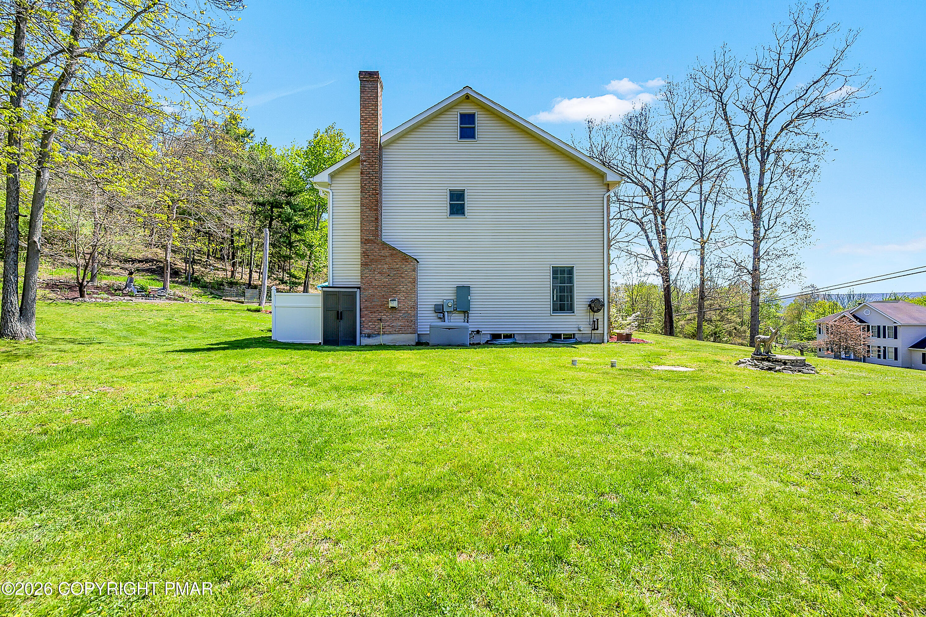 207 Smiley Lane Stroudsburg, PA 18360 - Photo 5 of 85 a front view of house with yard and green space