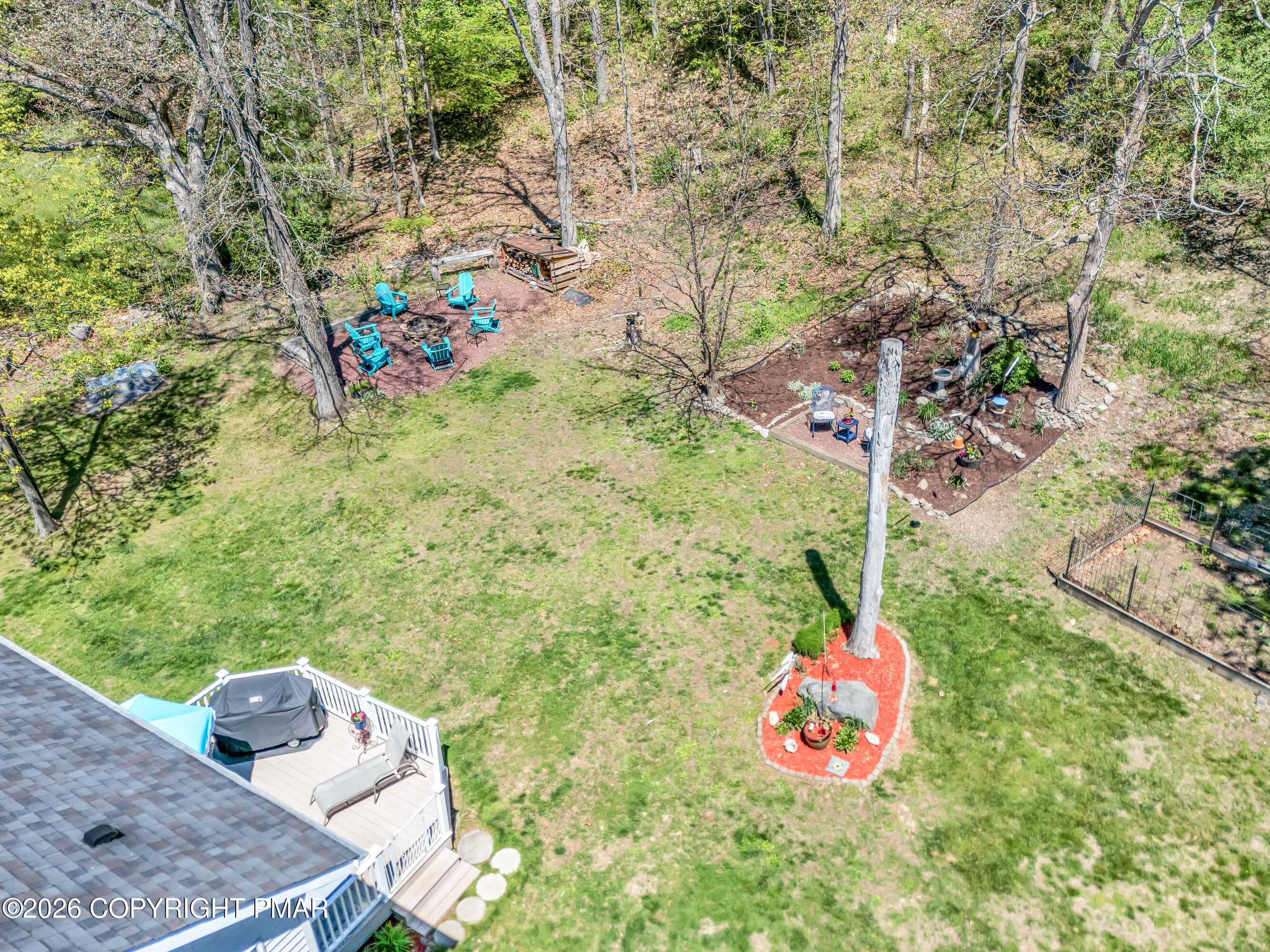 207 Smiley Lane Stroudsburg, PA 18360 - Photo 71 of 85 a small garden with a bench