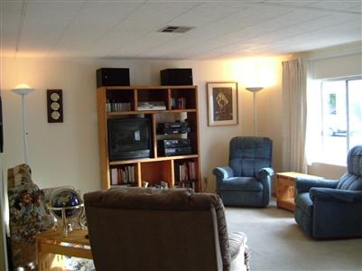 294 Yosemite Road, Unit 294 San Rafael, CA 94903 - Photo 2 of 7 a living room with furniture a walk in closet and a window