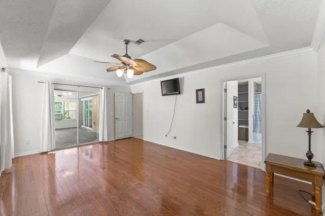 a view of livingroom with hardwood floor and a ceiling fan