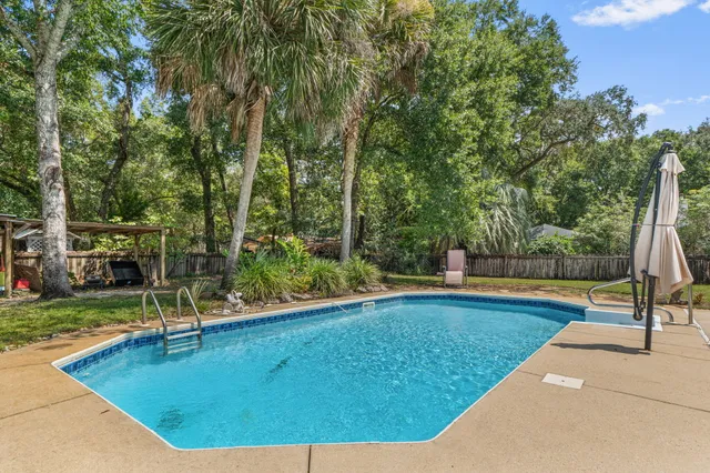 a view of a swimming pool with a patio