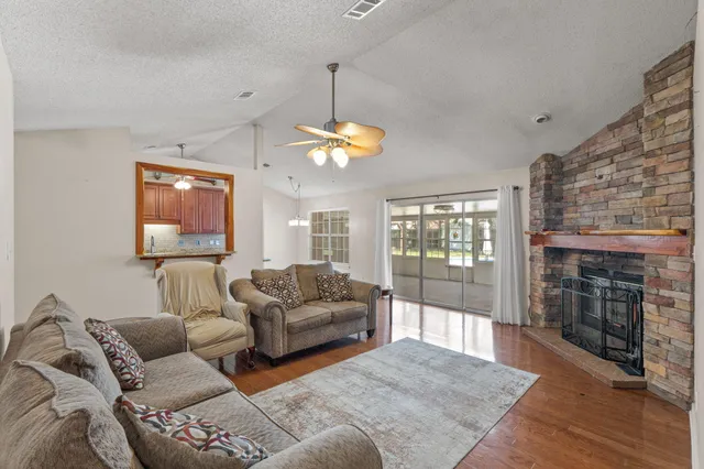 a living room with furniture fireplace and a fireplace