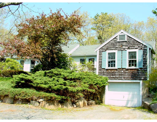 26 Indian Neck Road Wareham, MA 02571 - Photo 2 of 4 a front view of a house with a garden