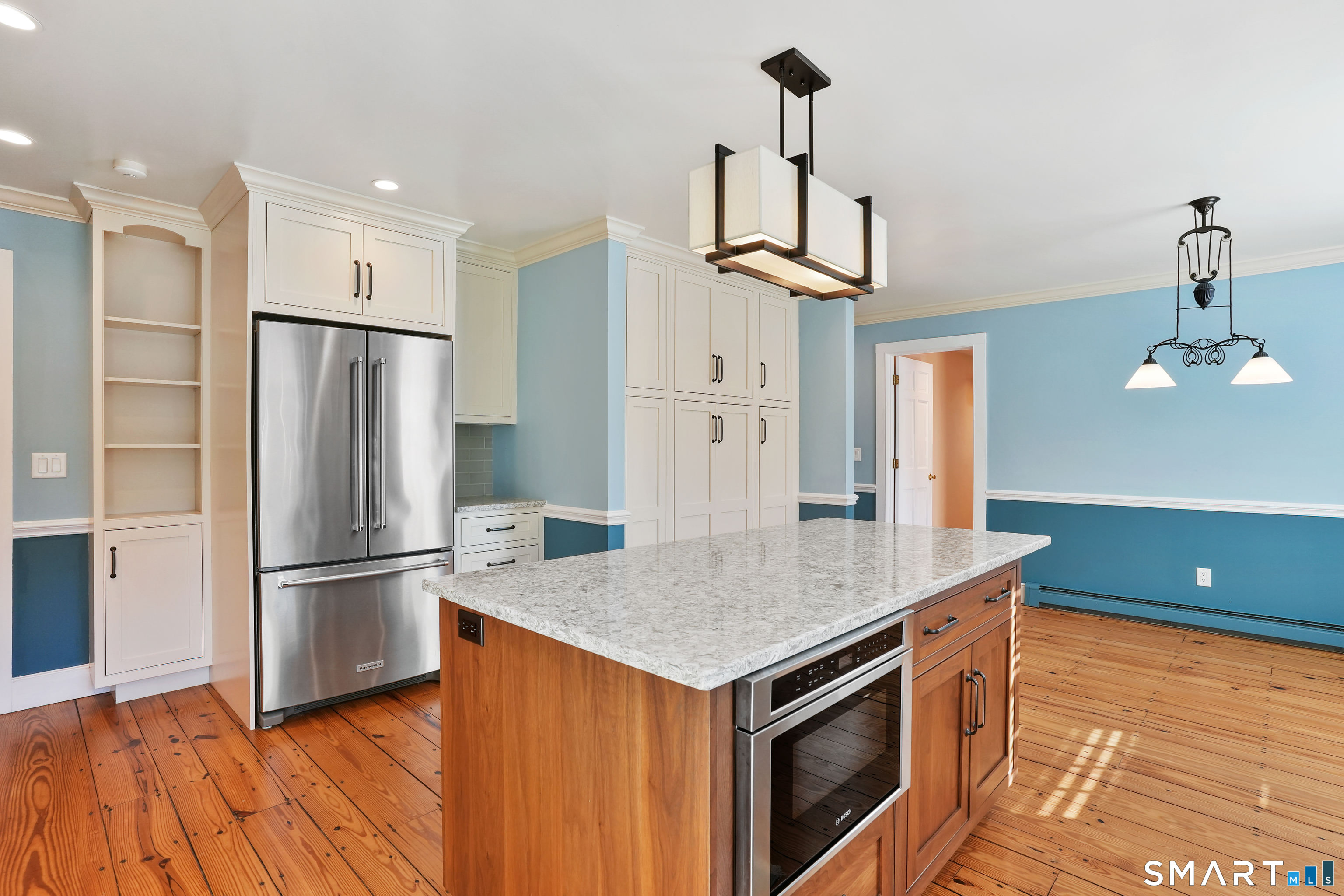 297 Long Mountain Road New Milford, CT 06776 - Photo 12 of 40 a kitchen with stainless steel appliances granite countertop a refrigerator a sink and a stove