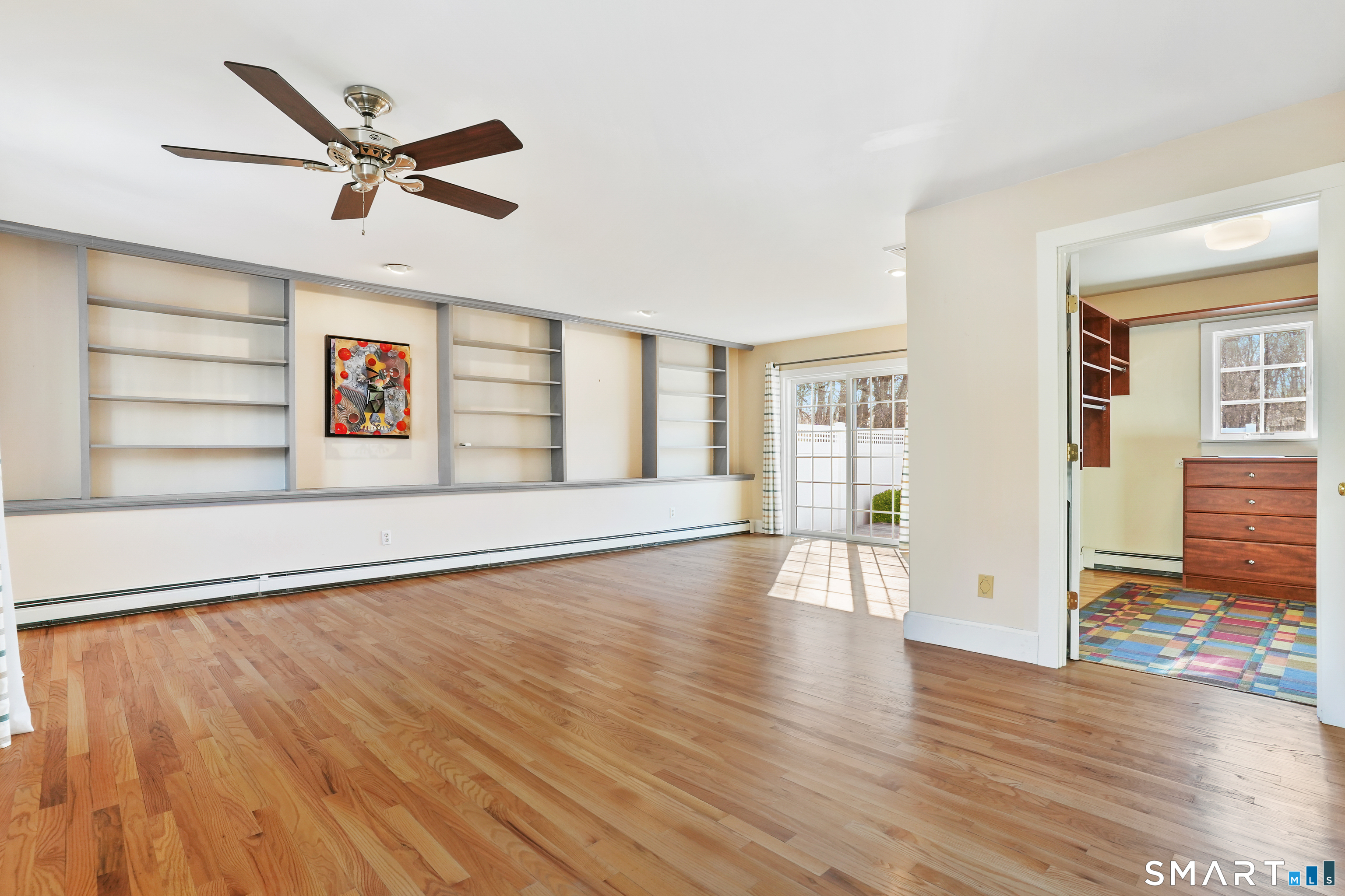 297 Long Mountain Road New Milford, CT 06776 - Photo 15 of 40 a view of an empty room with wooden floor and a window