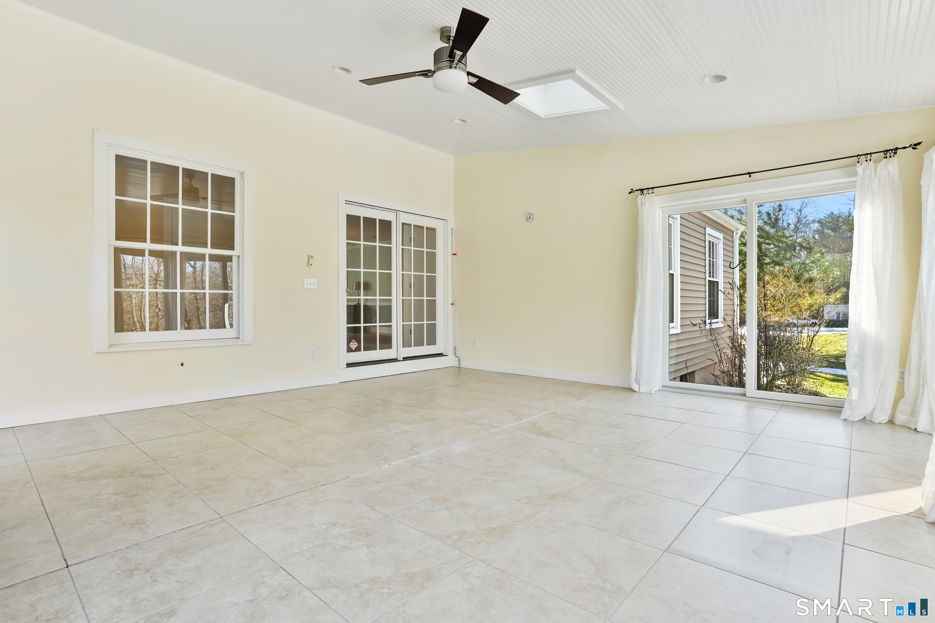 297 Long Mountain Road New Milford, CT 06776 - Photo 24 of 40 a view of an empty room with a window