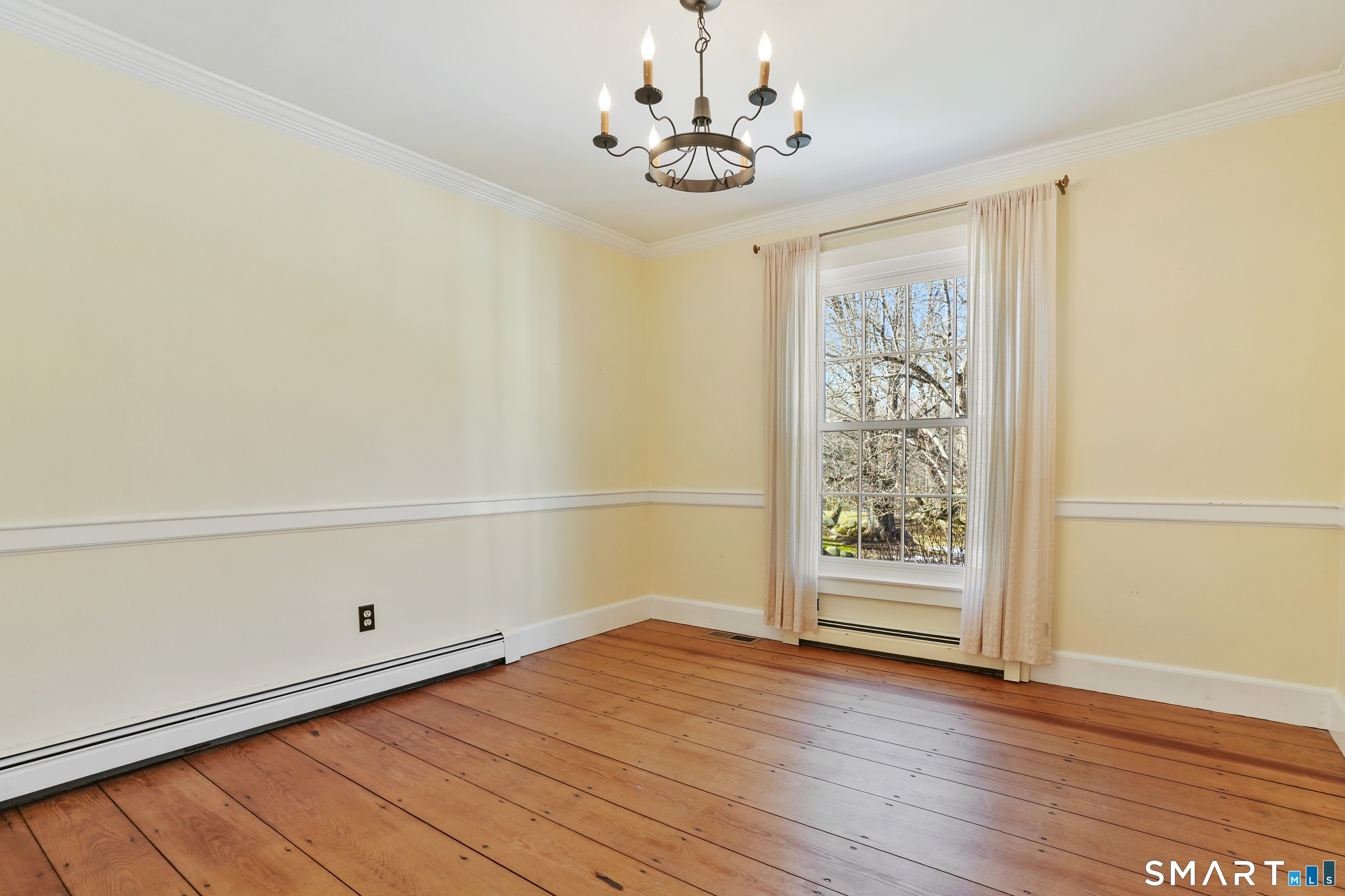 297 Long Mountain Road New Milford, CT 06776 - Photo 25 of 40 a view of an empty room with wooden floor