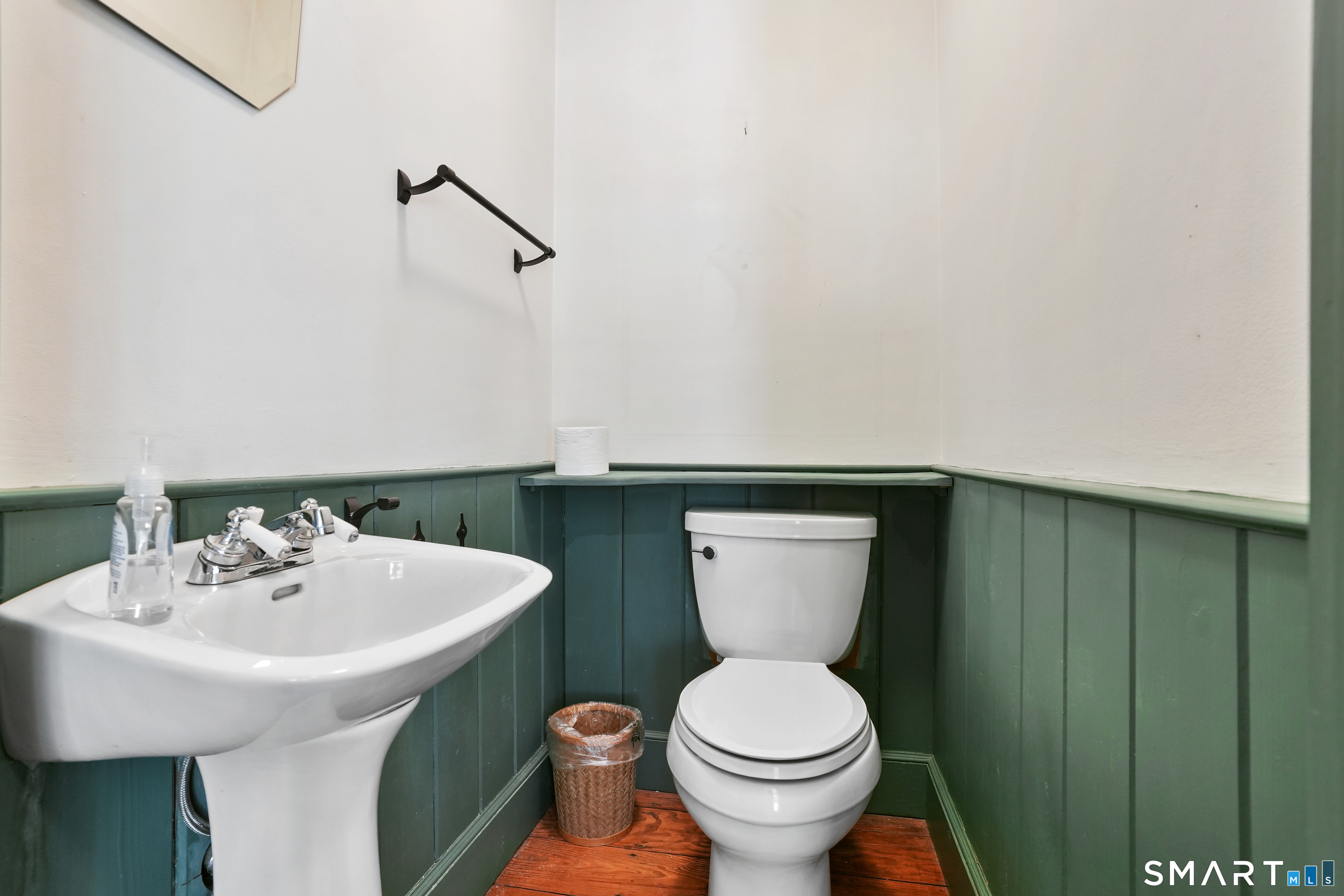 297 Long Mountain Road New Milford, CT 06776 - Photo 27 of 40 a bathroom with a toilet a sink and mirror