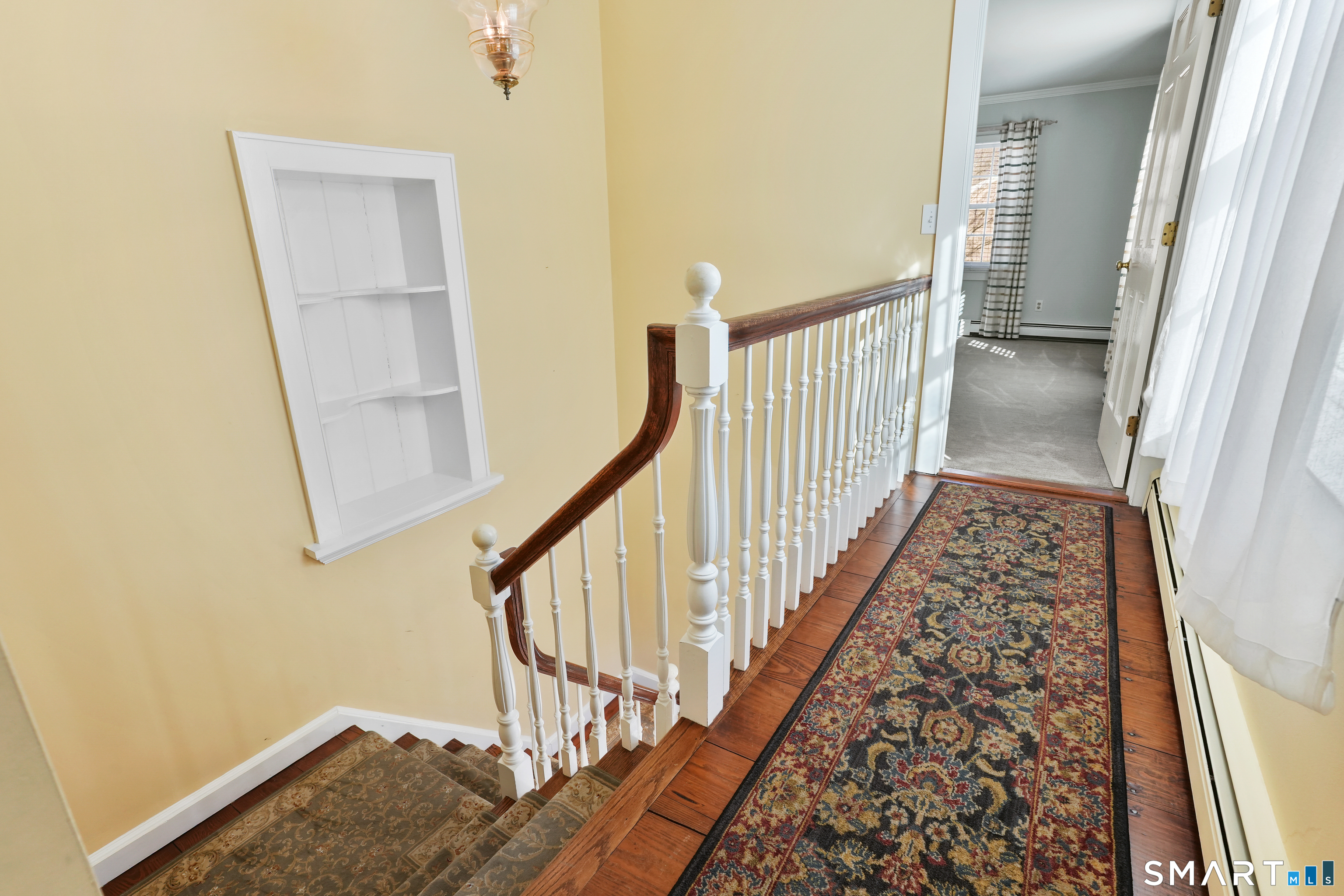 297 Long Mountain Road New Milford, CT 06776 - Photo 29 of 40 a view of staircase with white walls and a window