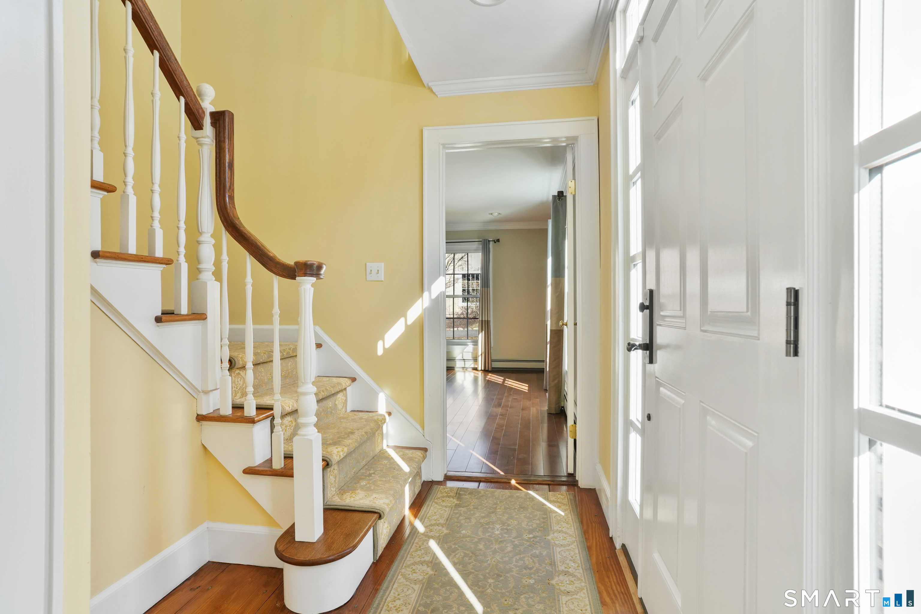 297 Long Mountain Road New Milford, CT 06776 - Photo 8 of 40 a view of an entryway with wooden floor and door