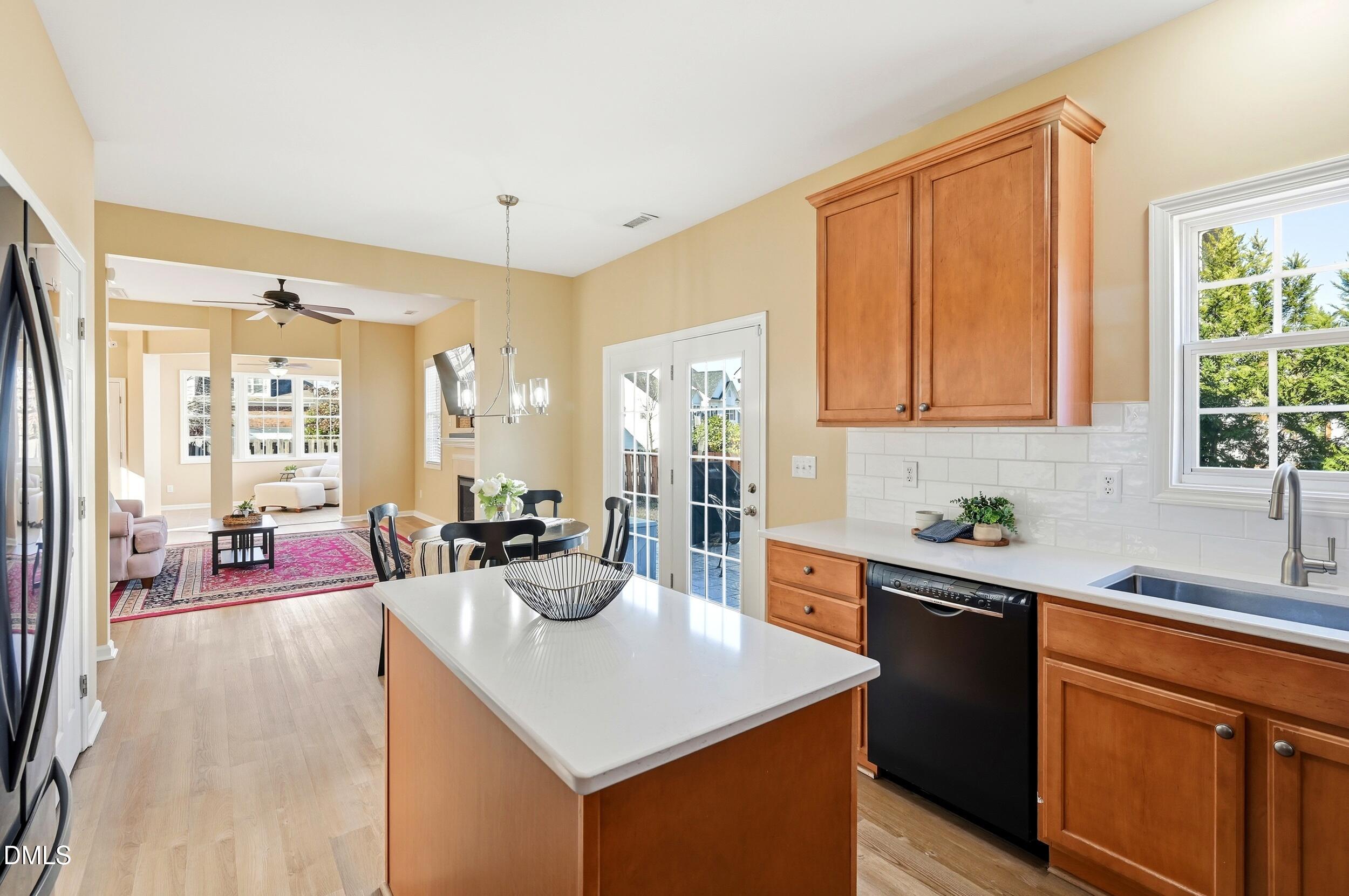 5401 Onyx Mill Court Raleigh, NC 27616 - Photo 19 of 48 a kitchen with a sink stove and cabinets