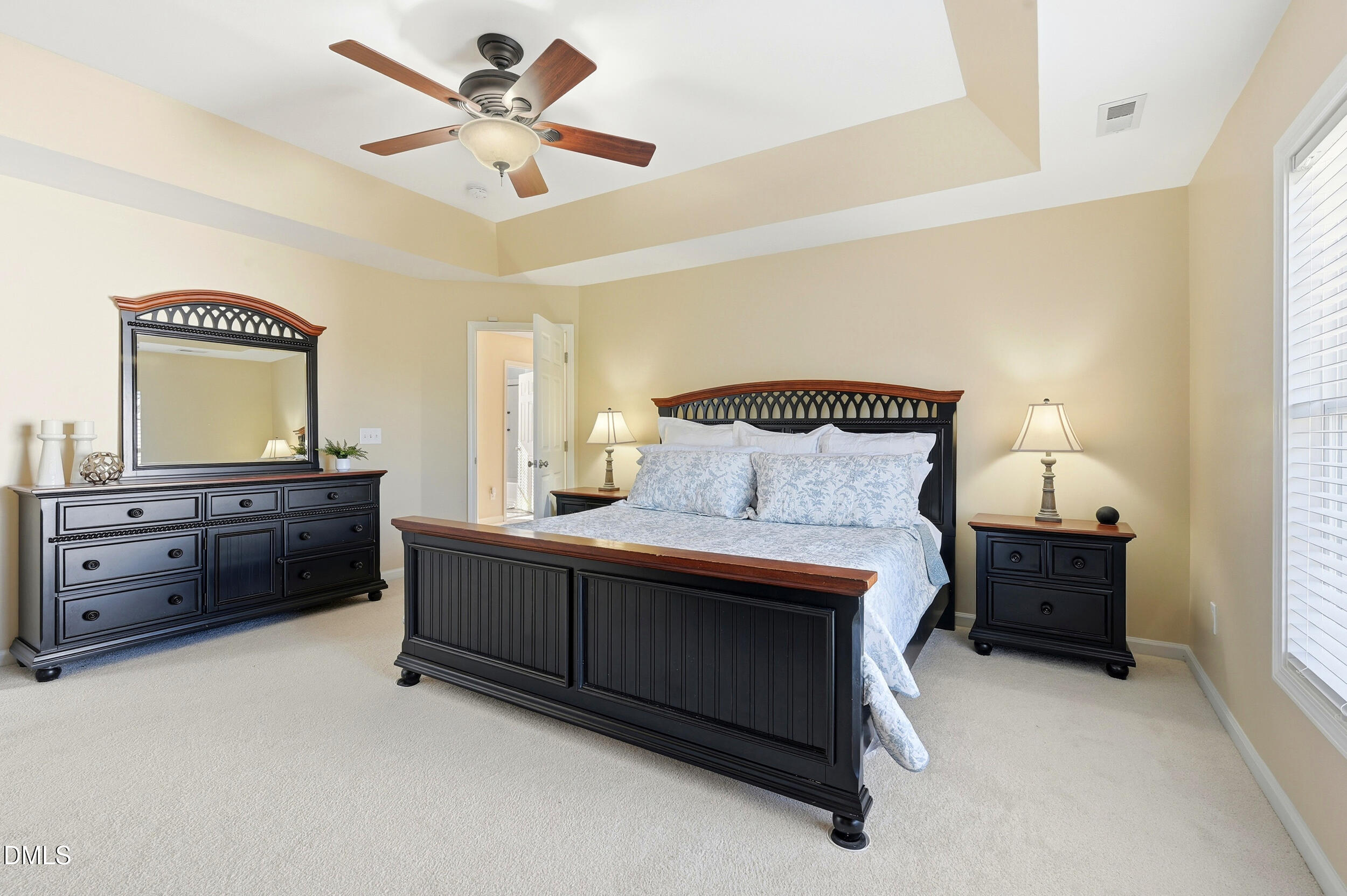 5401 Onyx Mill Court Raleigh, NC 27616 - Photo 26 of 48 a bedroom with a bed and a dresser