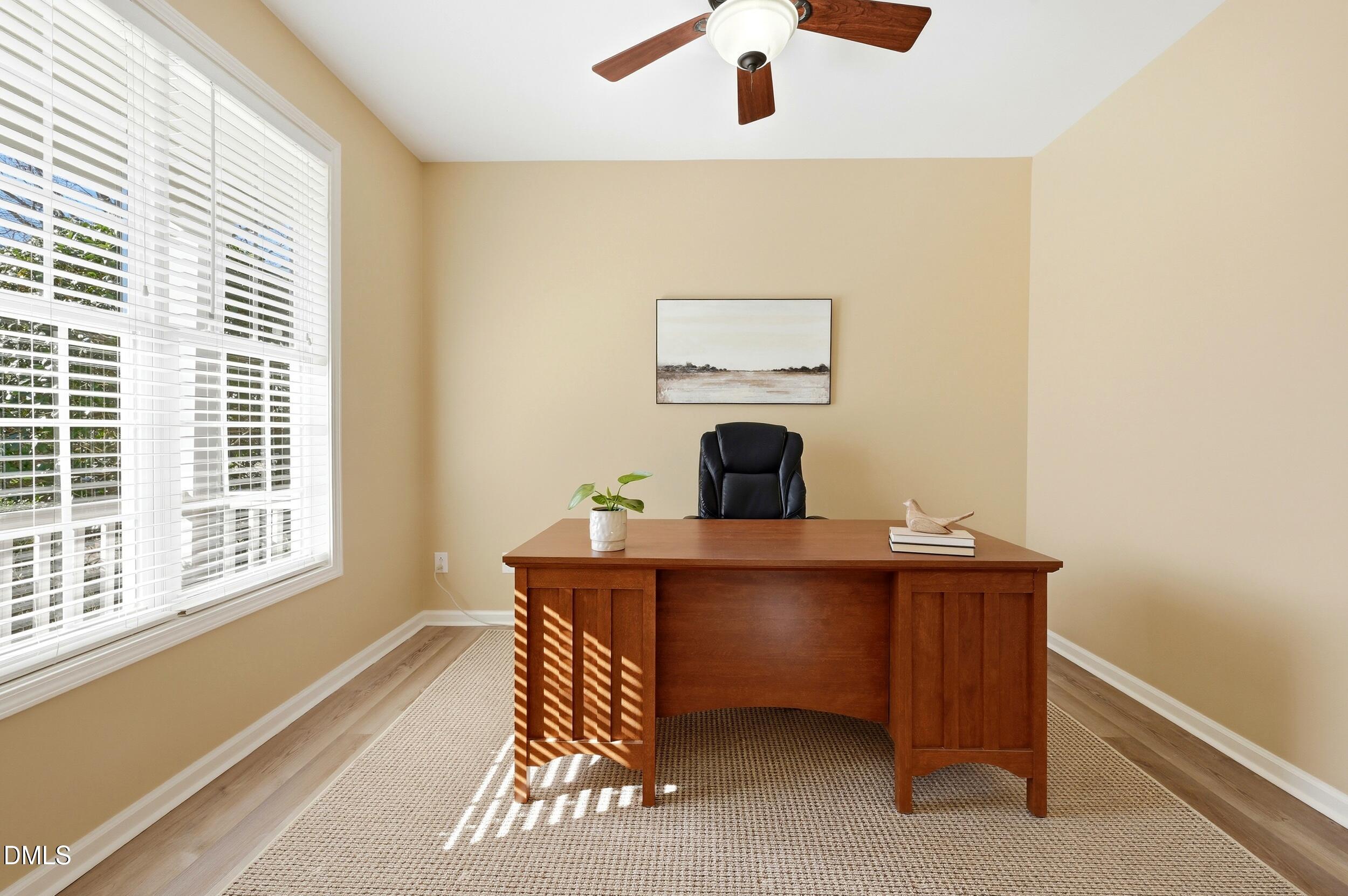 5401 Onyx Mill Court Raleigh, NC 27616 - Photo 9 of 48 a view of a workspace with furniture and a window