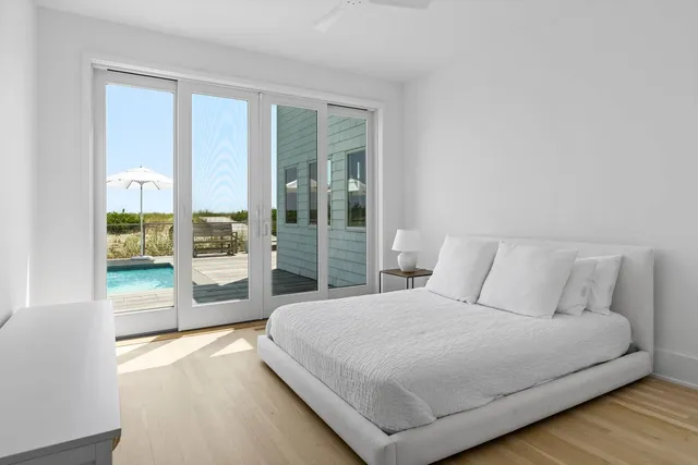 a bedroom with a large bed and a view of bedroom