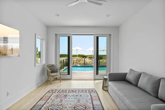 a living room with furniture and a rug