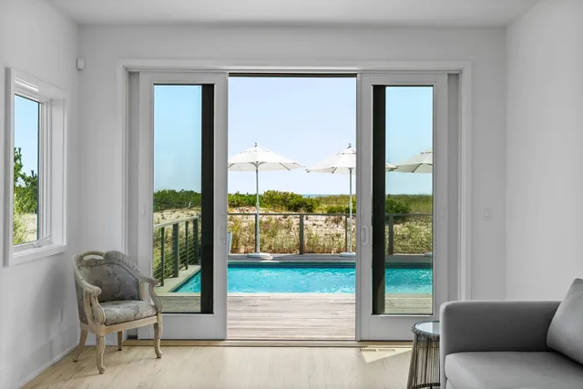 a living room with a large window and a couch