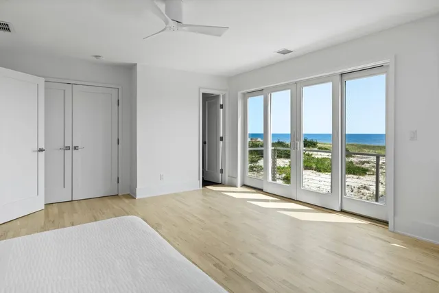 a view of an empty room with glass door