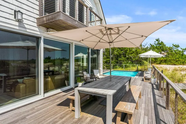 a view of backyard with a patio and a garden