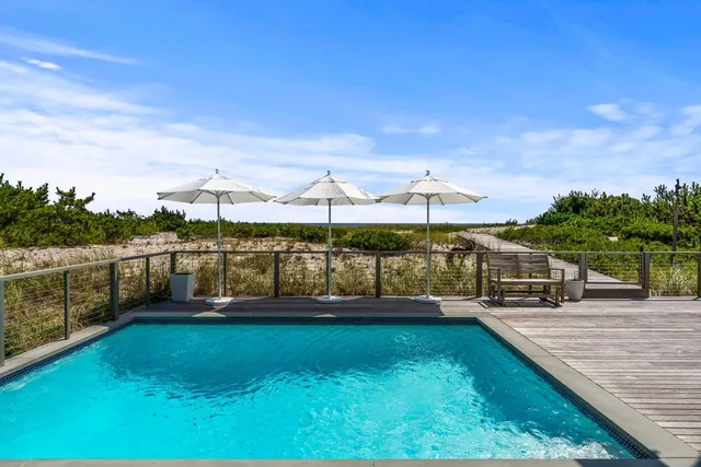 a view of swimming pool with a yard