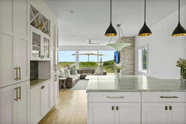 a view of living room with furniture and floor to ceiling window