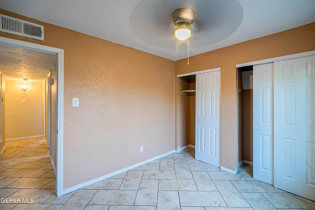 a view of a hallway with a chandelier