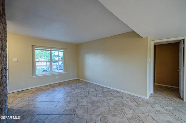 a view of an empty room and window