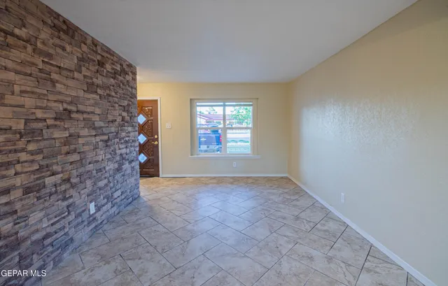 a view of an empty room and window