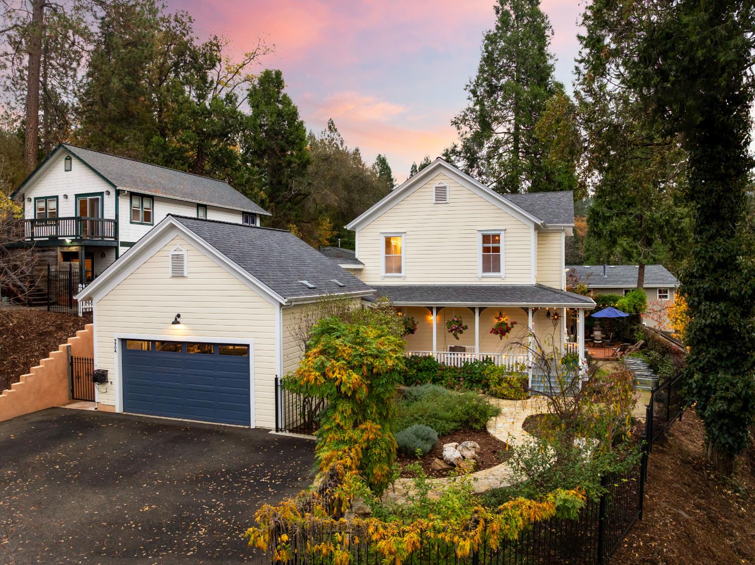 990 Thompson Way Placerville, CA 95667 - Photo 18 of 70 a front view of a house with a yard and garage