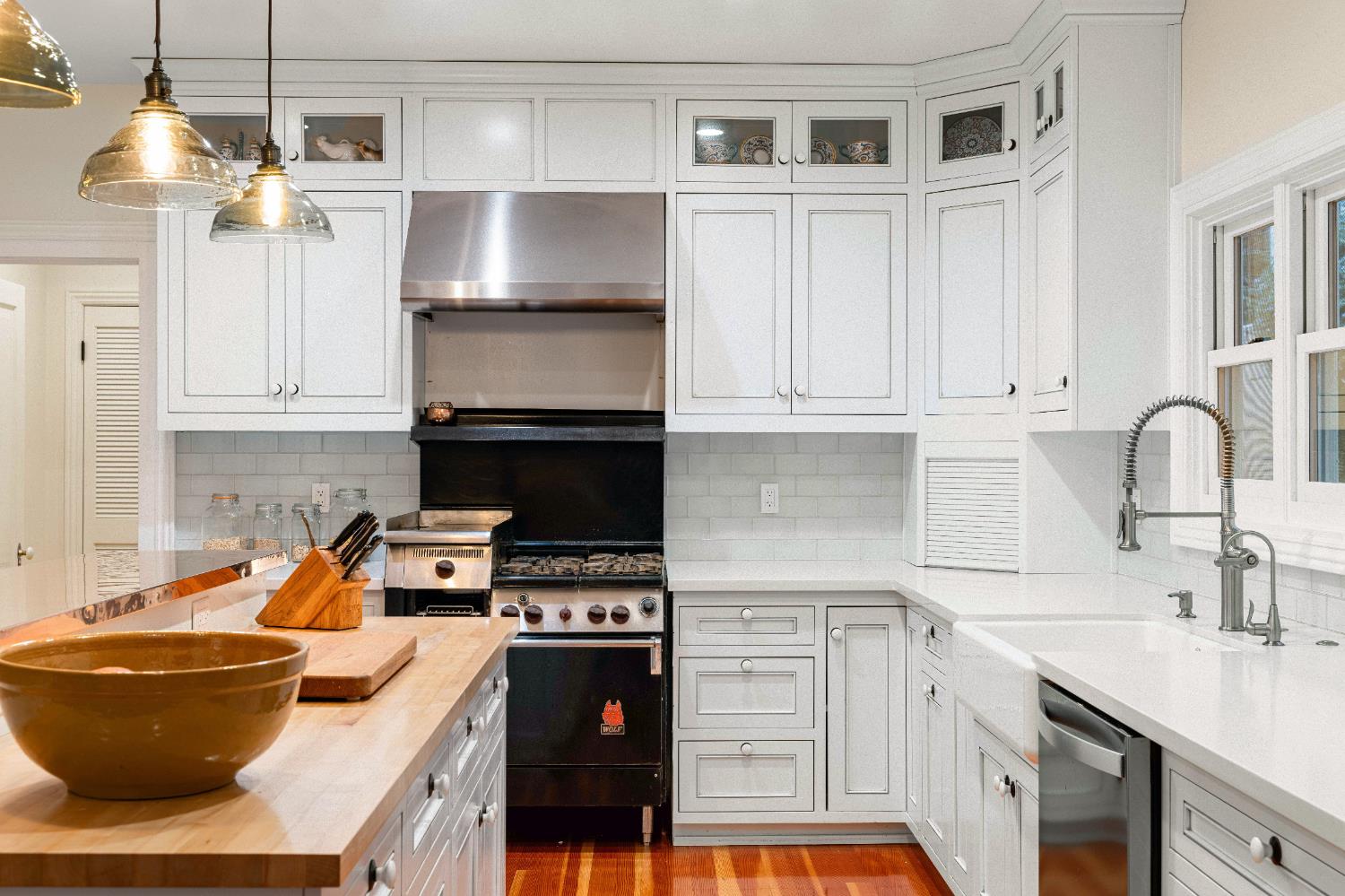 990 Thompson Way Placerville, CA 95667 - Photo 26 of 70 a kitchen with granite countertop a stove a sink and a refrigerator