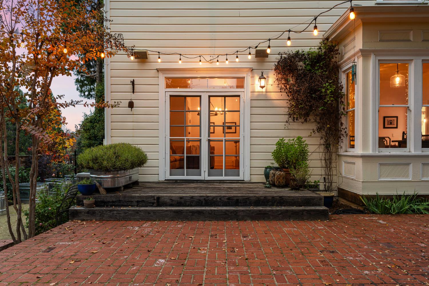 990 Thompson Way Placerville, CA 95667 - Photo 29 of 70 a view of a house with potted plants and a large window